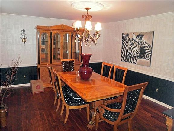 Formal dining room with hardwood floors