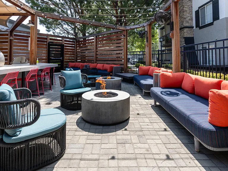 Outdoor Entertainment Area with Colorful Furniture and Grilling Station