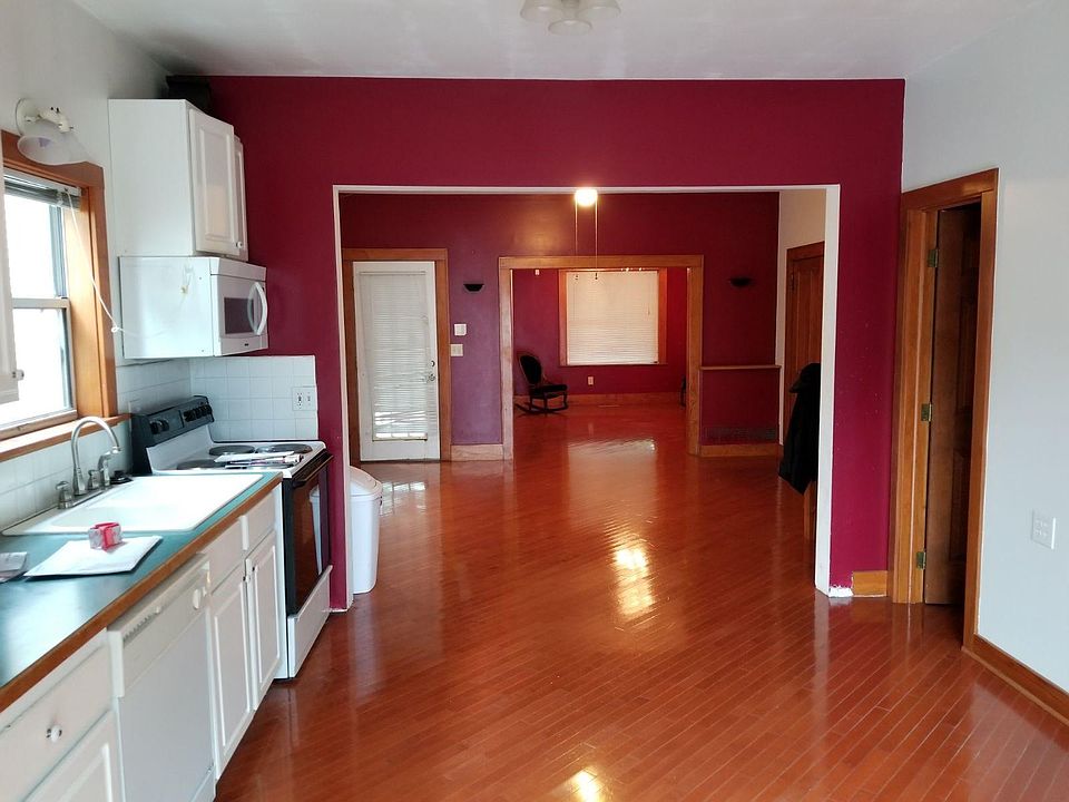 Kitchen is open to the dining/entry room and then to the living room. Sliding patio door leads to fenced in back yard (no dogs). The eat-in kitchen is spacious and has a laundry room/pantry connected.