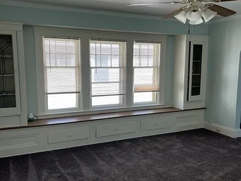 Dinning room cabinets with leaded glass on both sides. Plenty of storage in bottom drawers