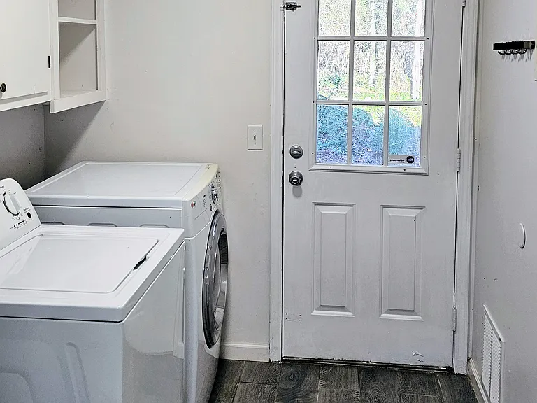 laundry room with extra storage