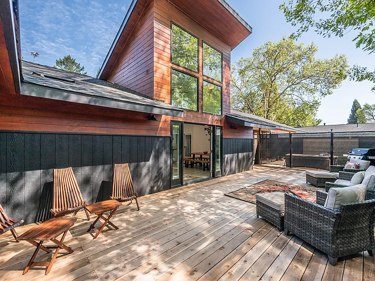 Indoor_outdoor living with doors open to spacious deck