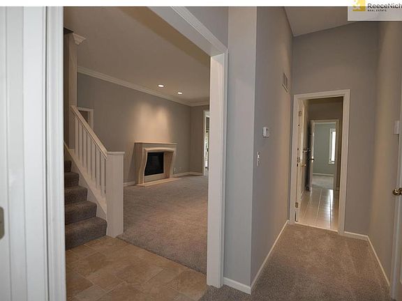 View from master bedroom out to the hall and living room