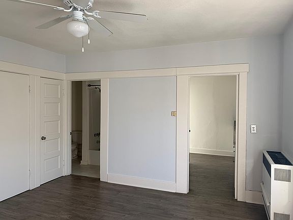 Living Room View Looking into Front Door, Bathroom, and Kitchen