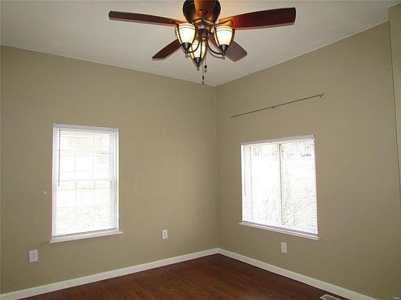 Living room offer care-free laminate floors & stylish ceiling fan with lights!