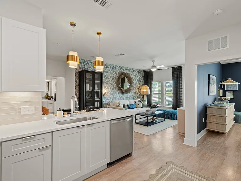 Kitchen Peninsula with Seating Space and View into Living Room