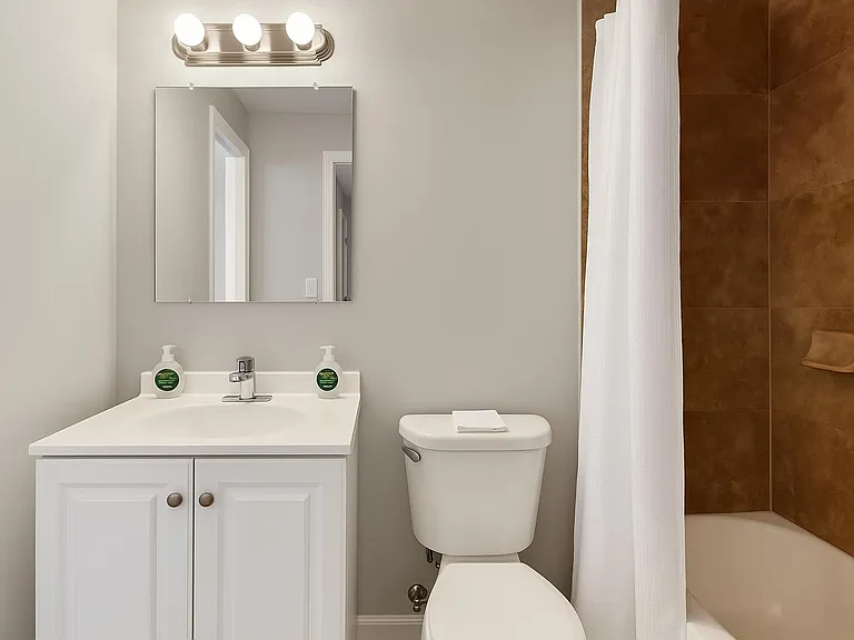 Inviting shared bathroom with walk-in shower, clean look, and easy everyday comfort