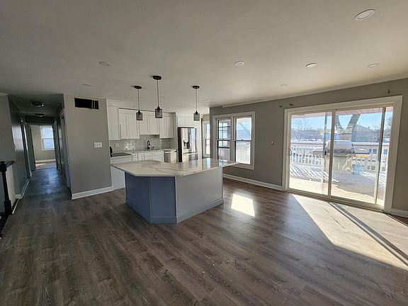 Second Floor: Kitchen and dining room area leading to rear porch on 2nd floor.