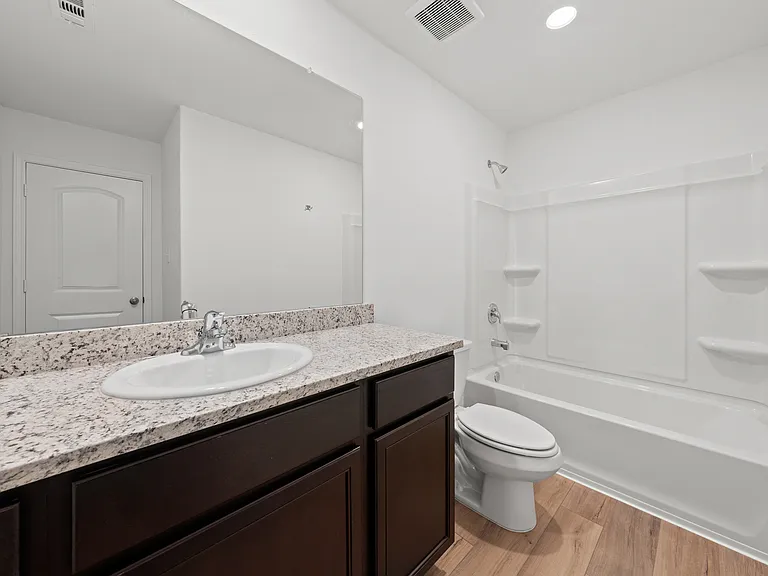 Spacious full bathroom.