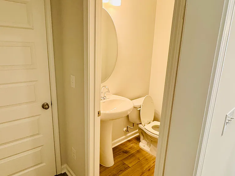 Car Garage Entry leads to a half bath and storage area.