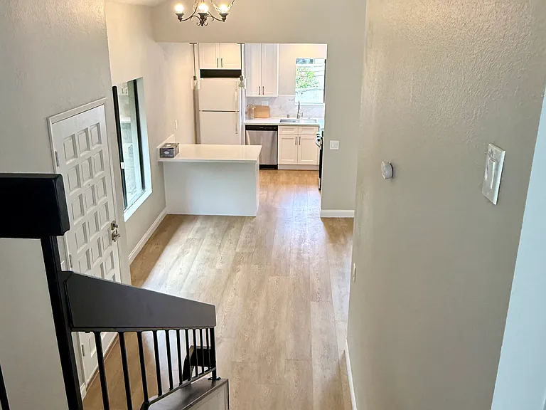 Looking down from split level into dining/kitchen area