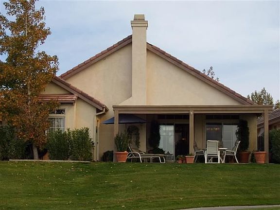 Backyard view of home from golf course.