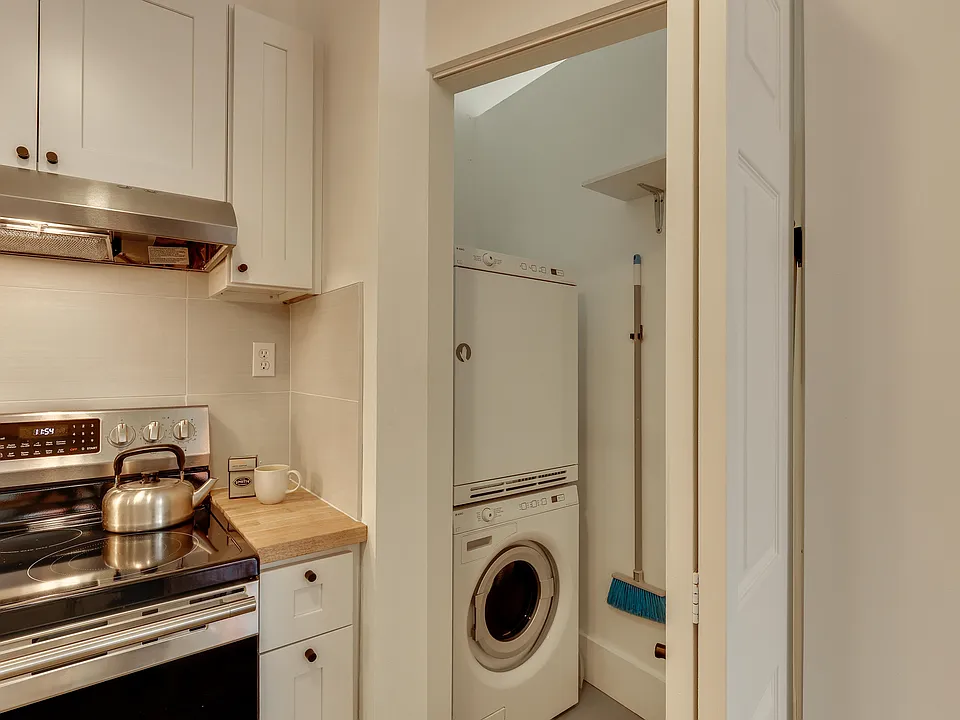 Laundry in closet adjsent to kitchen