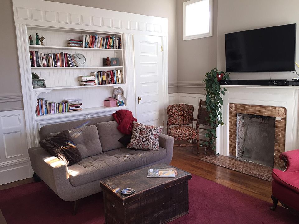 Family room off open to kitchen - old fashioned wall hutch - big windows and period details