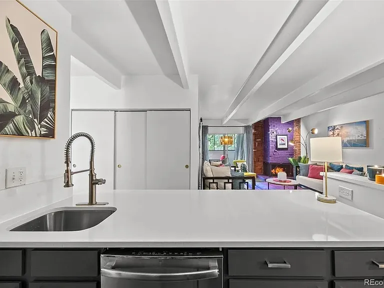 The open floor plan provides a light, airy space for cooking or time with friends; dishwasher is in this location