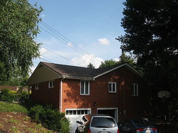 Two car garages.  Landscaped hillside