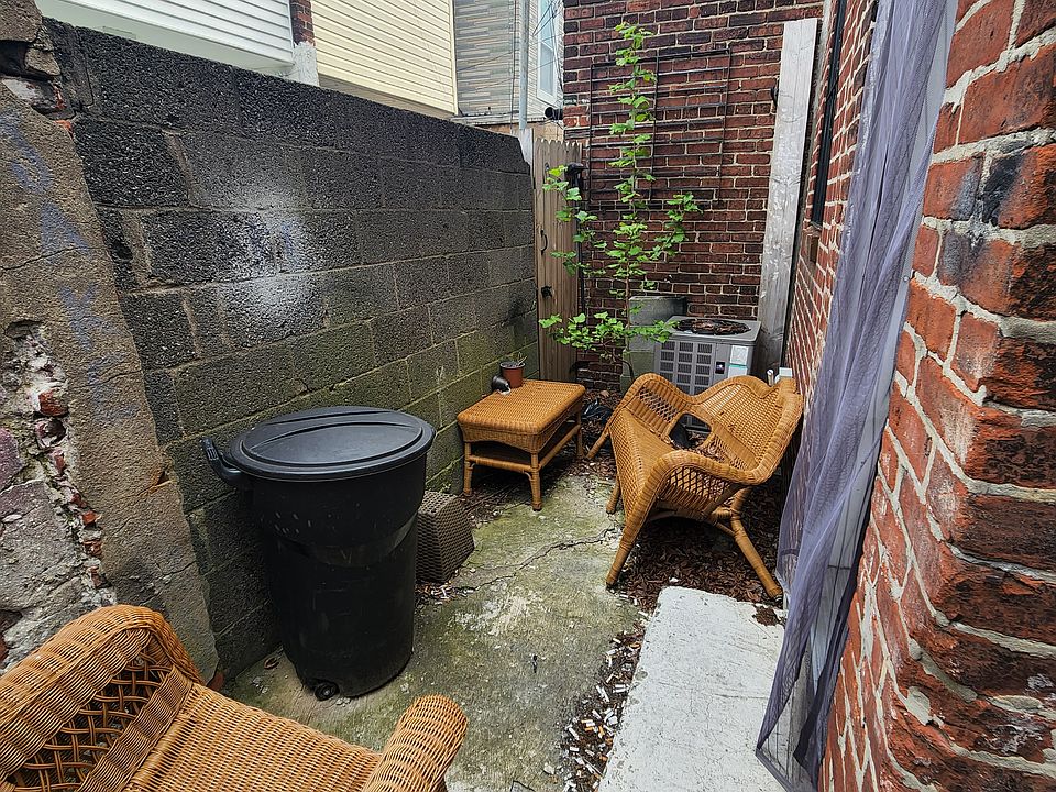 Backyard patio with previous tenant's furniture