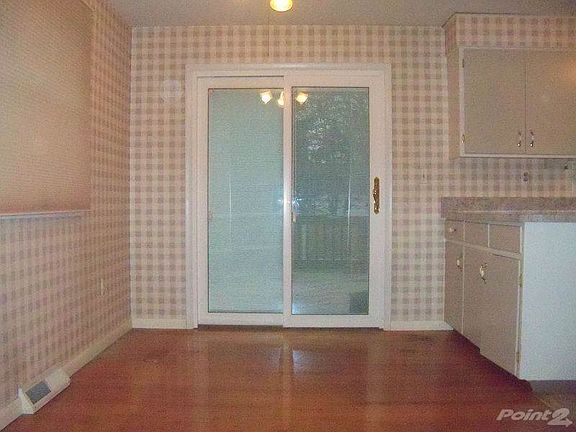 Formal dining room with slider leading to fully fenced in back yard.