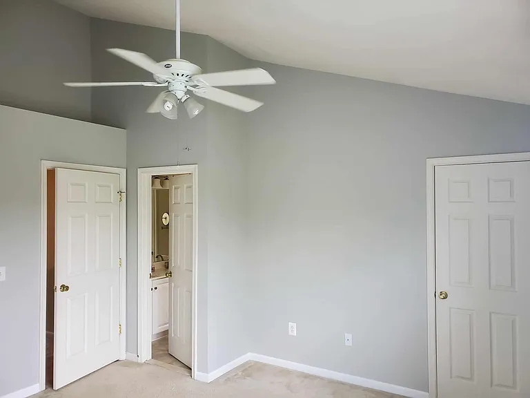 master looking at bathroom on the left and walk in closet on the right