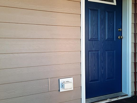Blue door entry and balcony.