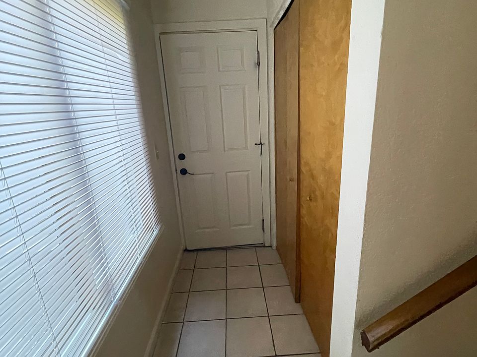 Hallway leading to garage access and washer/dryer area
