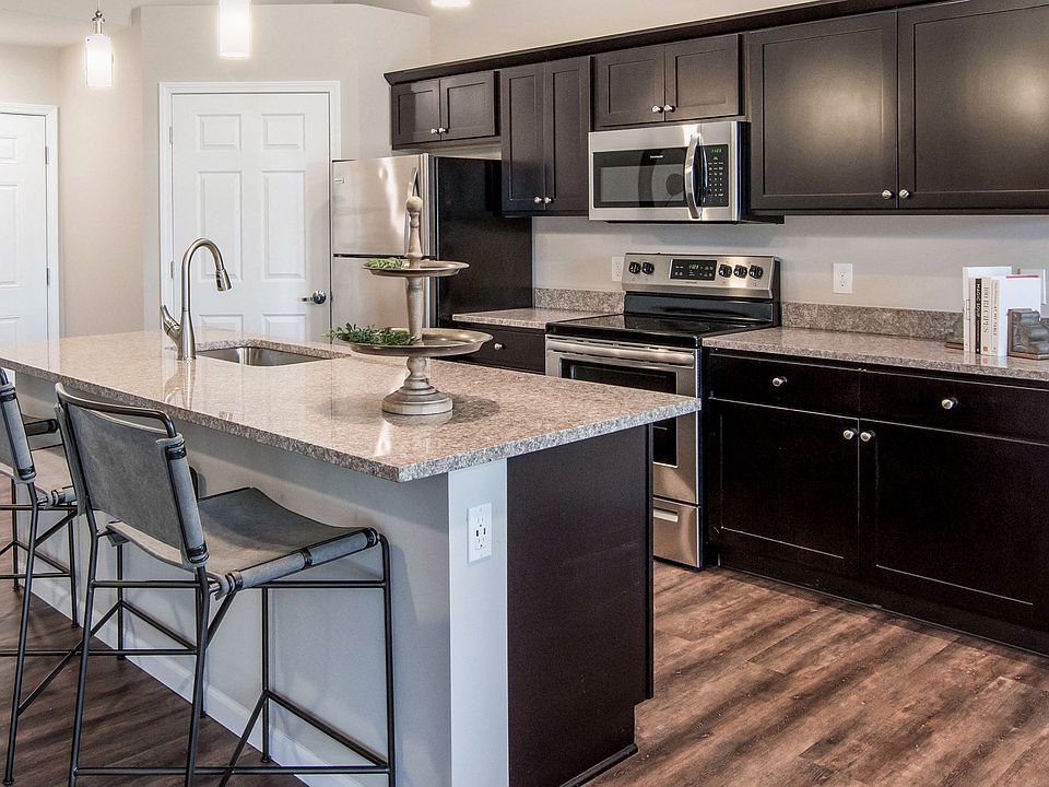 Enjoy a Spacious Kitchen, Complete with Granite Counters and a Generous Island