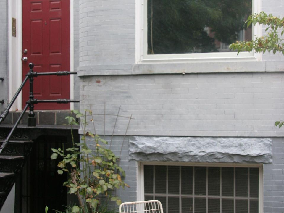 Table, 2 chairs, and small front yard.