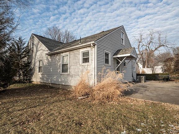 This door leads to a courtyard patio.   There are abundant perennials in the yard.