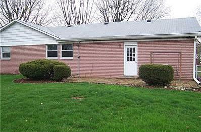 Exterior Back. Patio space with landscaping