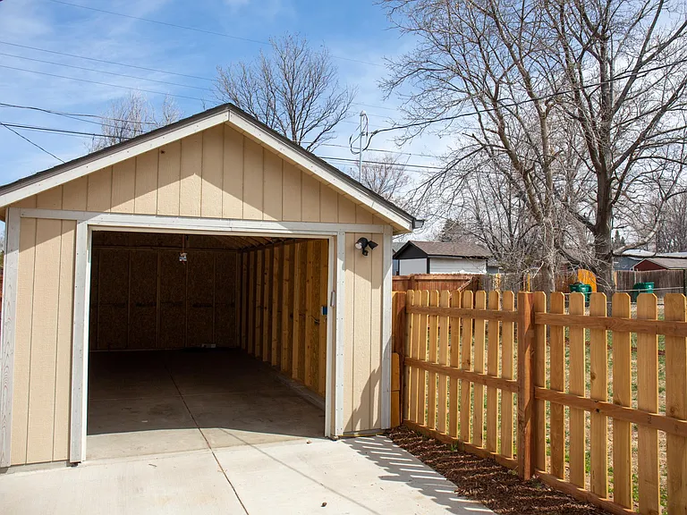 Powered garage with brand new garage door opener.