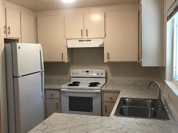 Kitchen with new counters, sink, and faucet