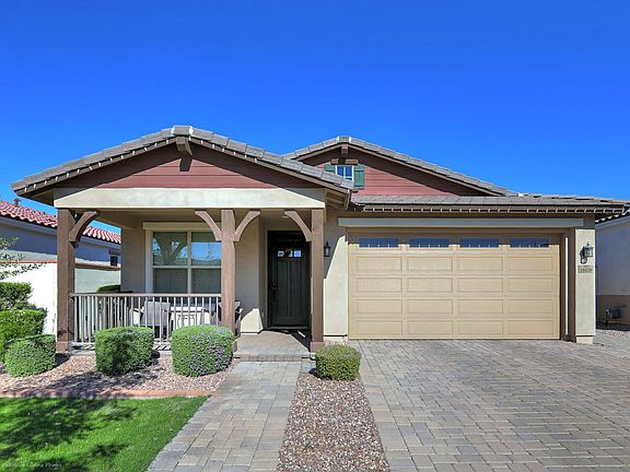 Highly upgraded home in Eastmark offering rare privacy! No neighbors in the back and single story homes on both sides.