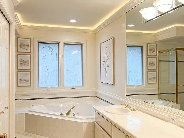 Spa-like primary bath with soaking tub and separate glass shower (computer staged)