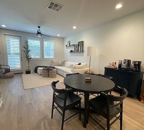 Open concept living with dining set in addition to bar seating.