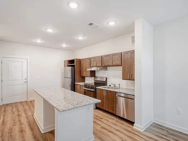 Unit Kitchen with Front Door in the Background
