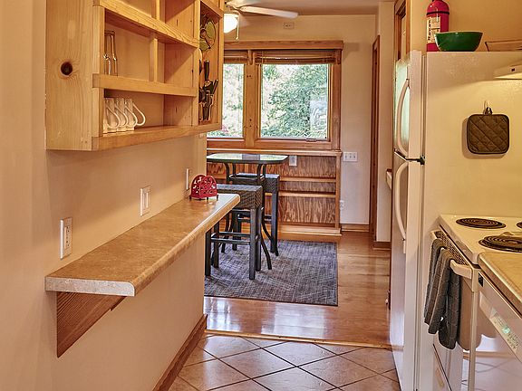 Entrance into the apartment from the deck through the galley kitchen.