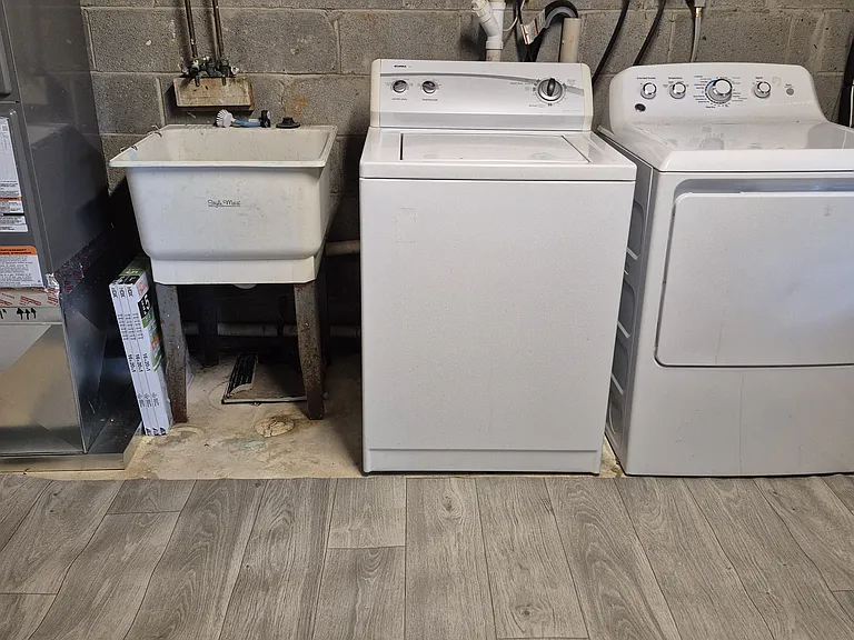 Laundry tub, washer & dryer in basement