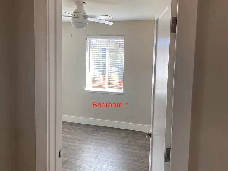 Bedroom 1- corner room with two large windows and ample sized closet