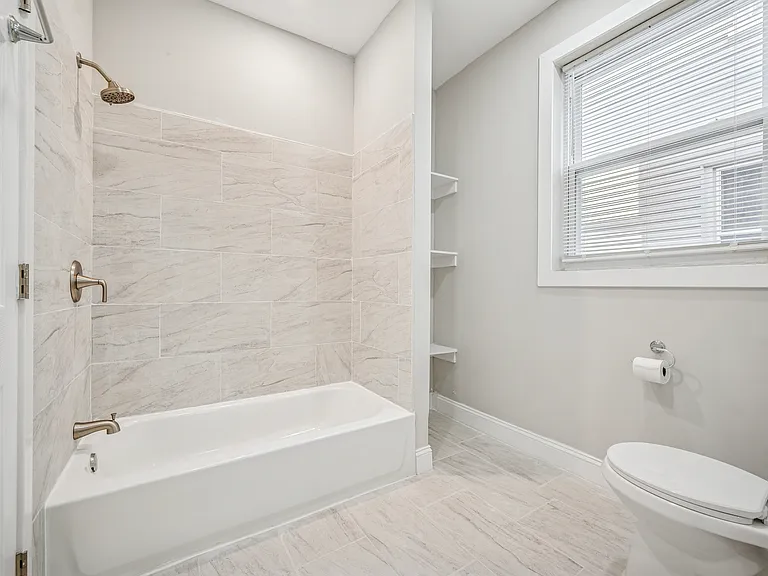 Modern/upgraded bathroom retreat with shelving space
