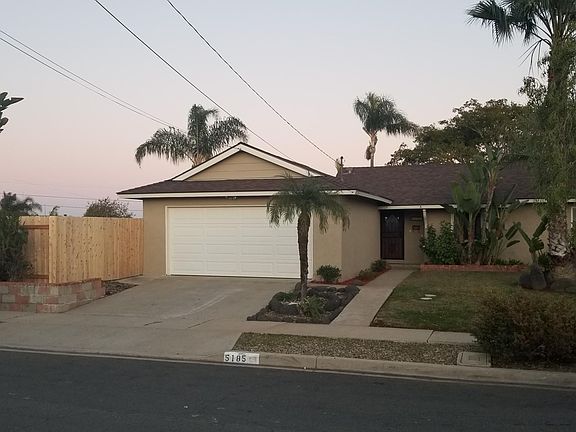 New side yard fencing with large gate for easy accessibility