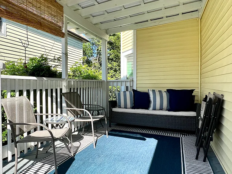New covered back porch. Great place to sit during a rain.