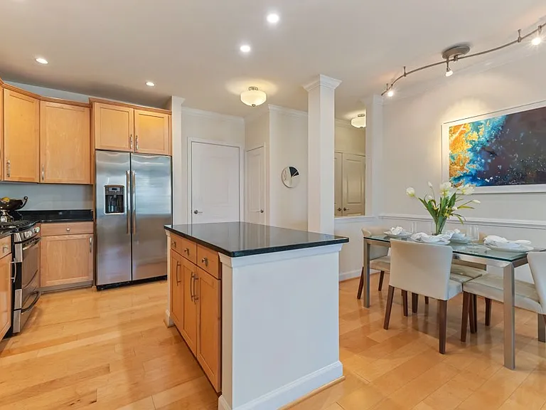 Open floor plans with crown molding in kitchen, living and dining rooms