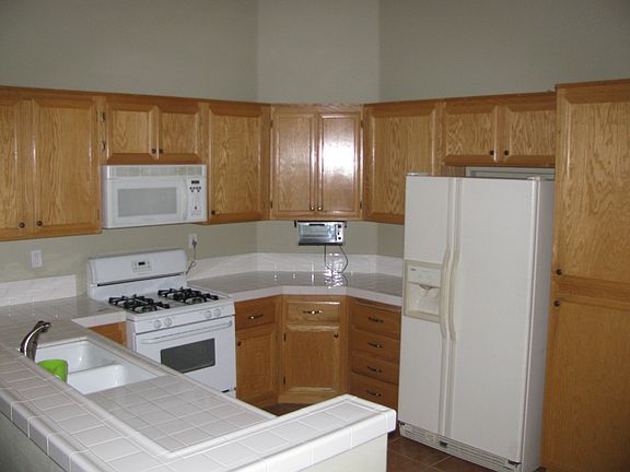 Kitchen with refrigerator