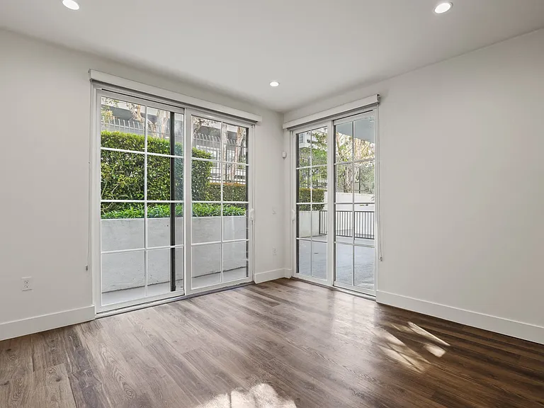Living Room with Patio, Recessed Lighting, and Vinyl Flooring