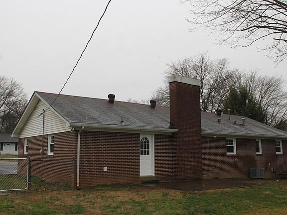 Rear patio with mature shade trees -