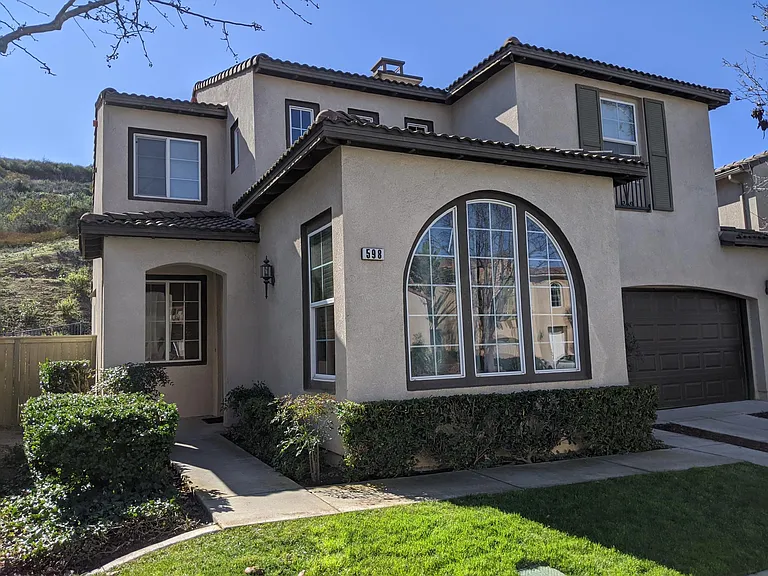 Front of house - in gated community and HOA takes care of the front landscaping. The house backs the canyon with nobody behind you for extra privacy.