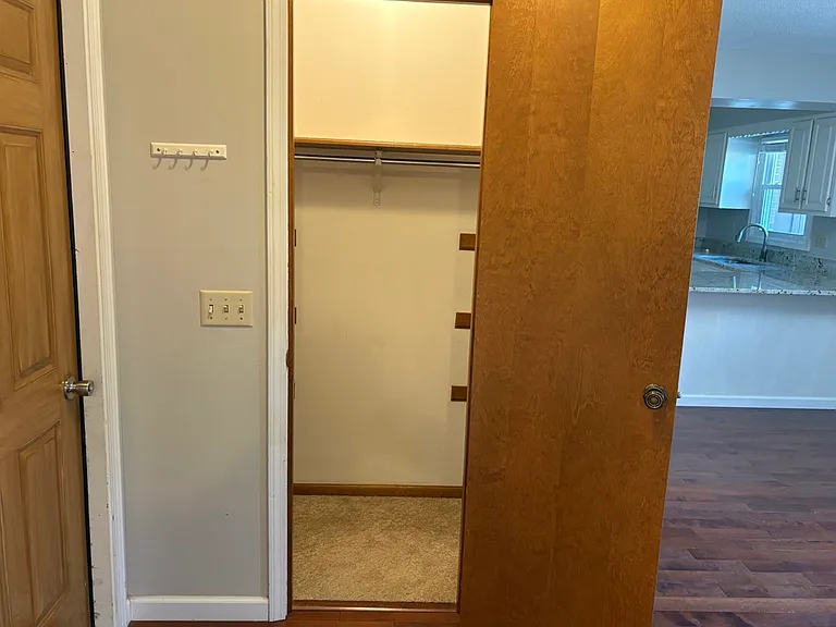 Coat closet next to garage door