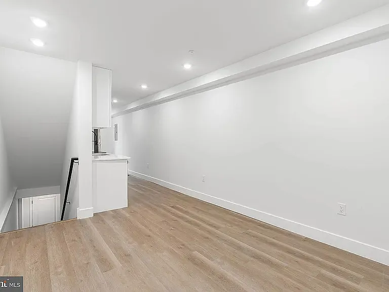 Flexible living space. Opposite view. Facing stairs to basement.