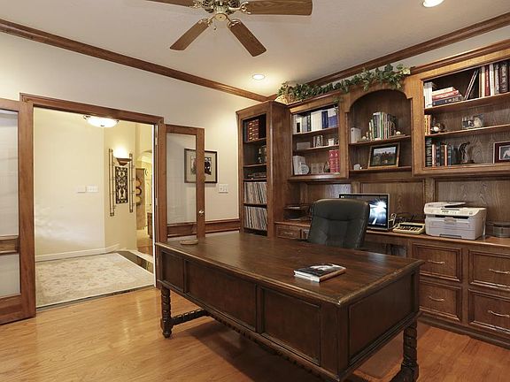 13'X15' Office/Study features hardwoods and custom built ins.