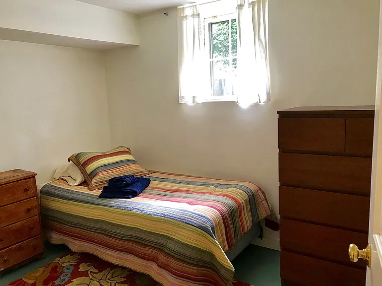 This is one of the two bedrooms. There is a SINGLE bed, bureau and closet in the space, there is no room to bring your own bed or personal furniture.